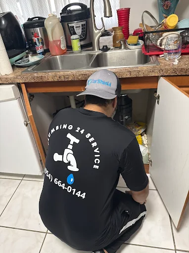 Plumbing 24 Service plumber repairing shower and bathtub plumbing in Broward County