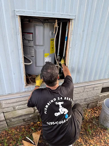 Plumbing 24 Service plumber fixing kitchen sink in Tamarac FL