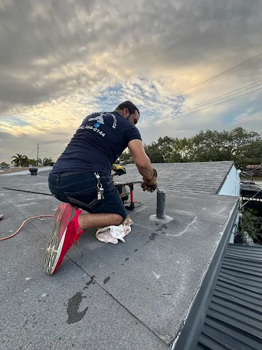 Plumbing 24 Service plumber repairing bathroom vanity plumbing in Broward County